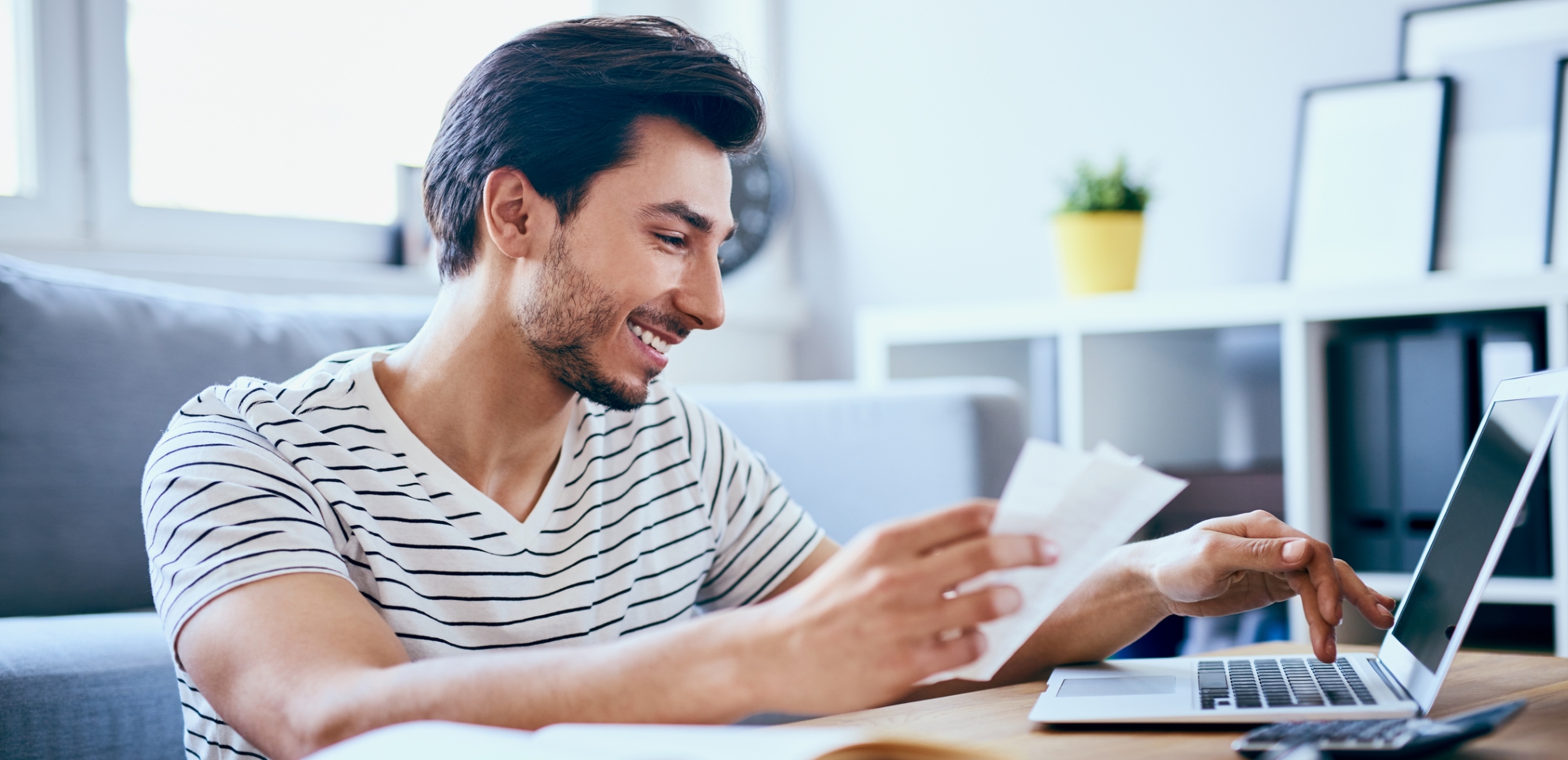 man paying bill online